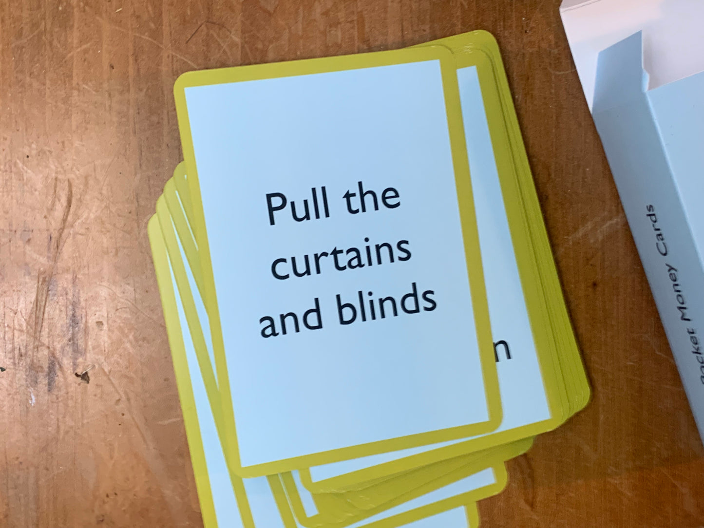 A Pocket Money Card showing the text: Pull the curtains and blinds.